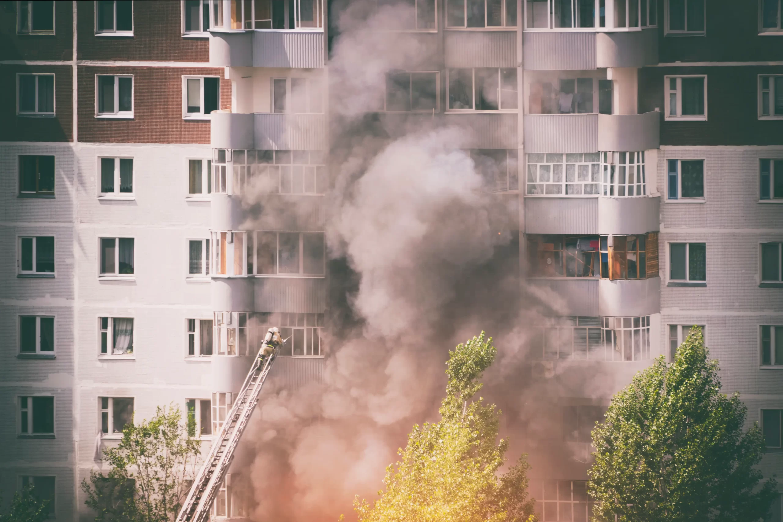 firefighters-extinguish-fire-multistory-apartment-building-toned