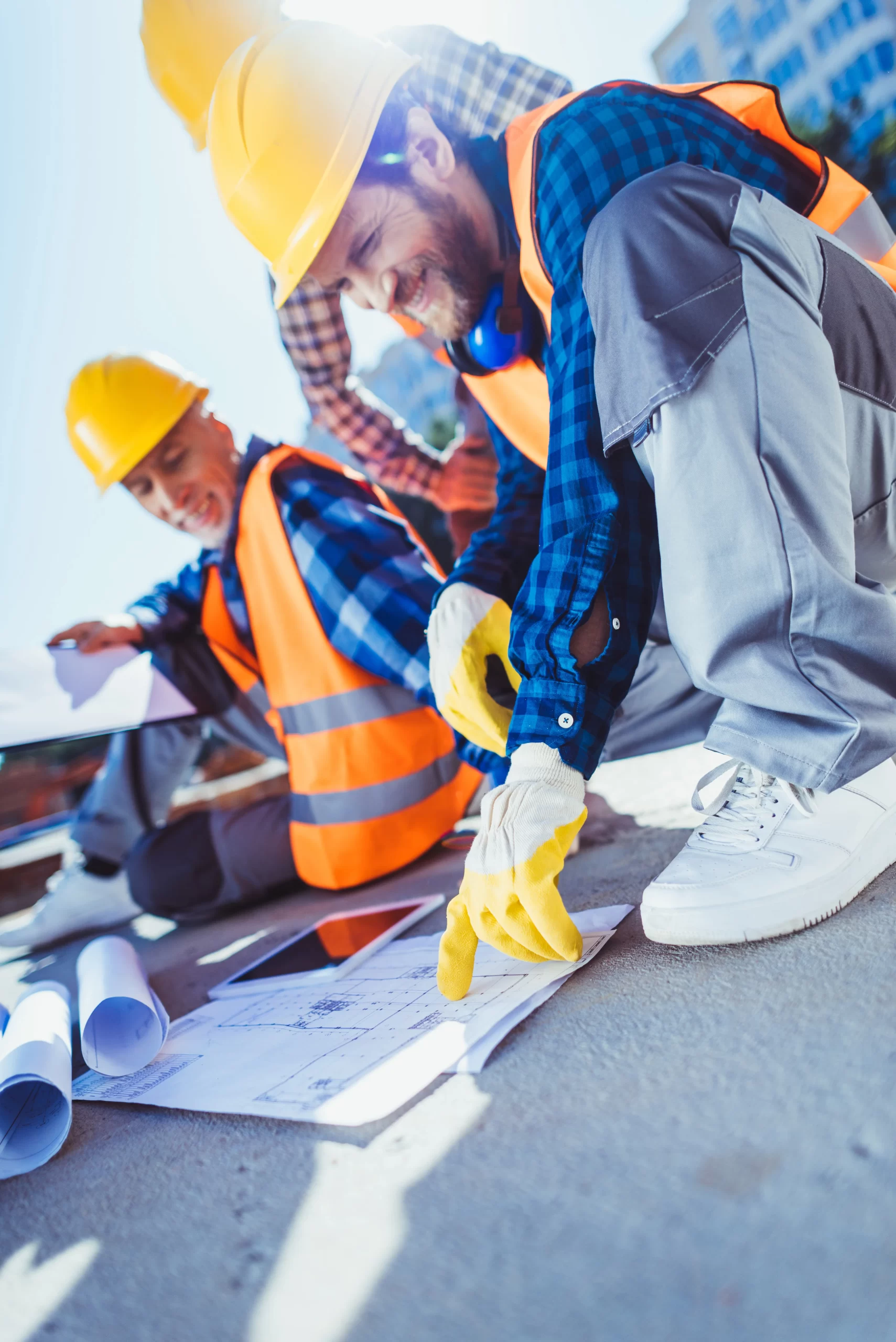 https://gulfcoastmitigators.com/wp-content/uploads/2024/04/smiling-construction-workers-in-hardhats-sitting-o-2023-11-27-04-49-55-utc-scaled.webp